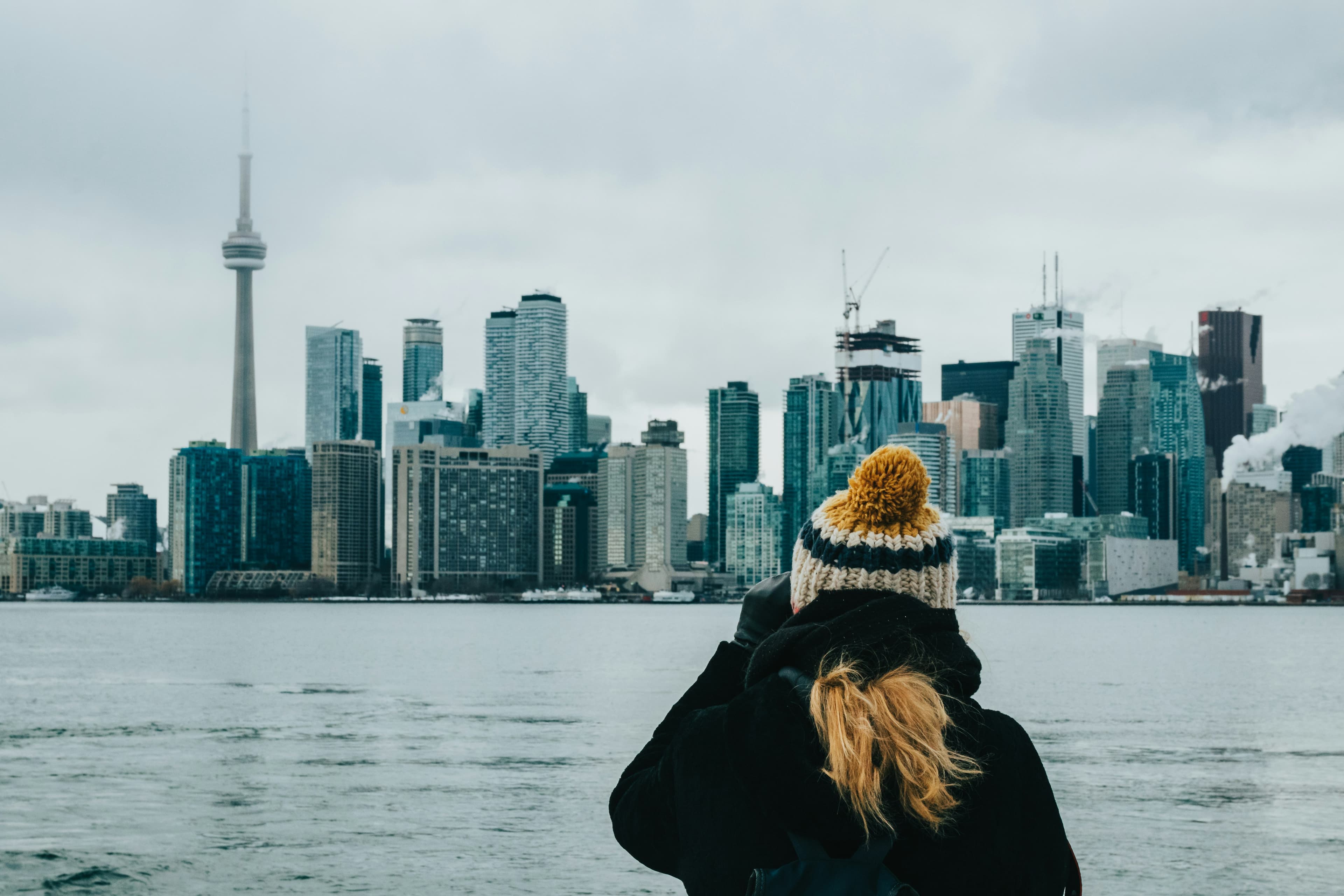 Applicant viewing the Toronto skyline while planning a move to Canada